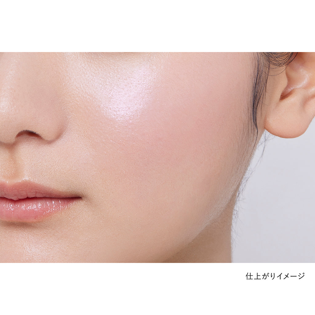 Close-up of a model's cheek showcasing the natural finish of Kanebo Mood Boosting Blush in pink and white tones.