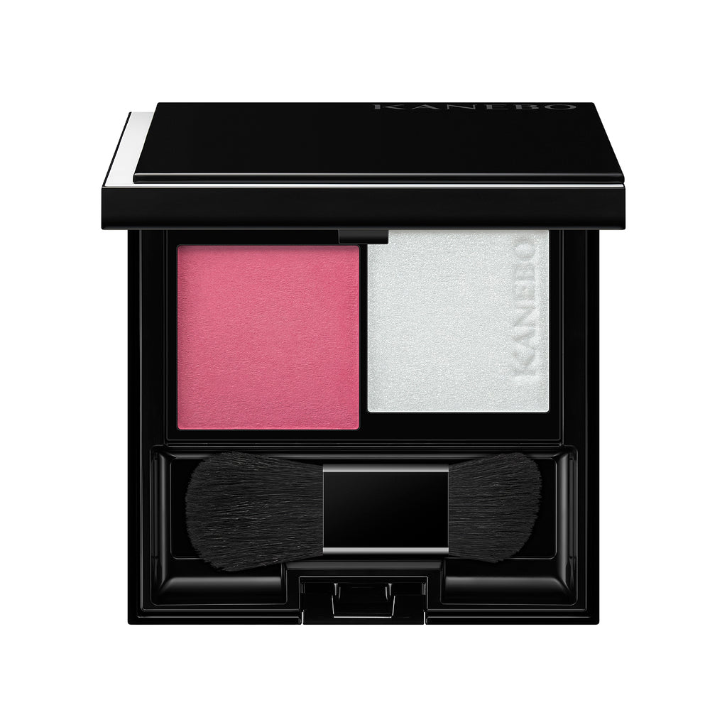 Kanebo Mood Boosting Blush in pink and white shades with a compact design, dual brush, and sleek black case.