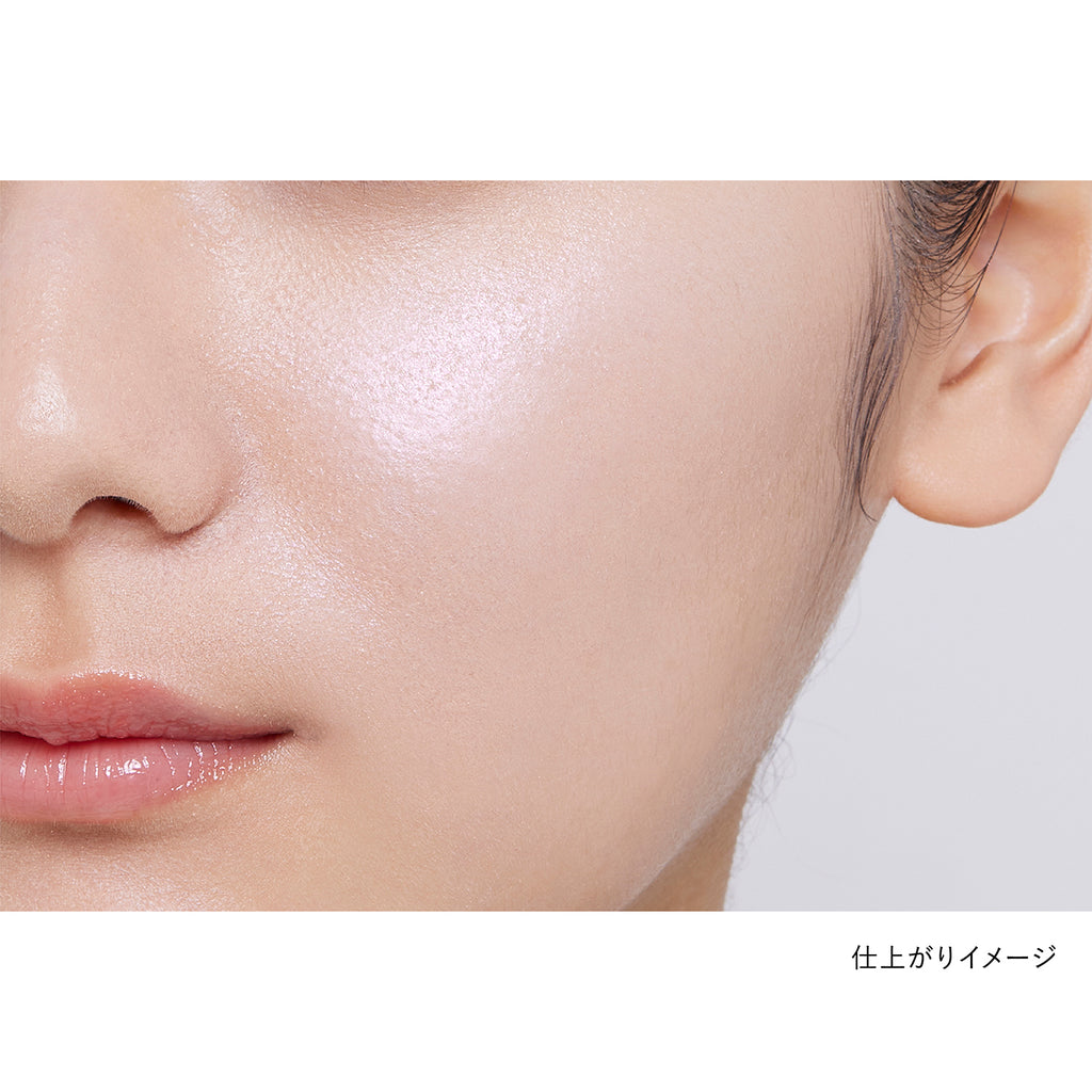 Close-up of a model's cheek showcasing the natural finish of Kanebo Mood Boosting Blush in peach and mint green tones.