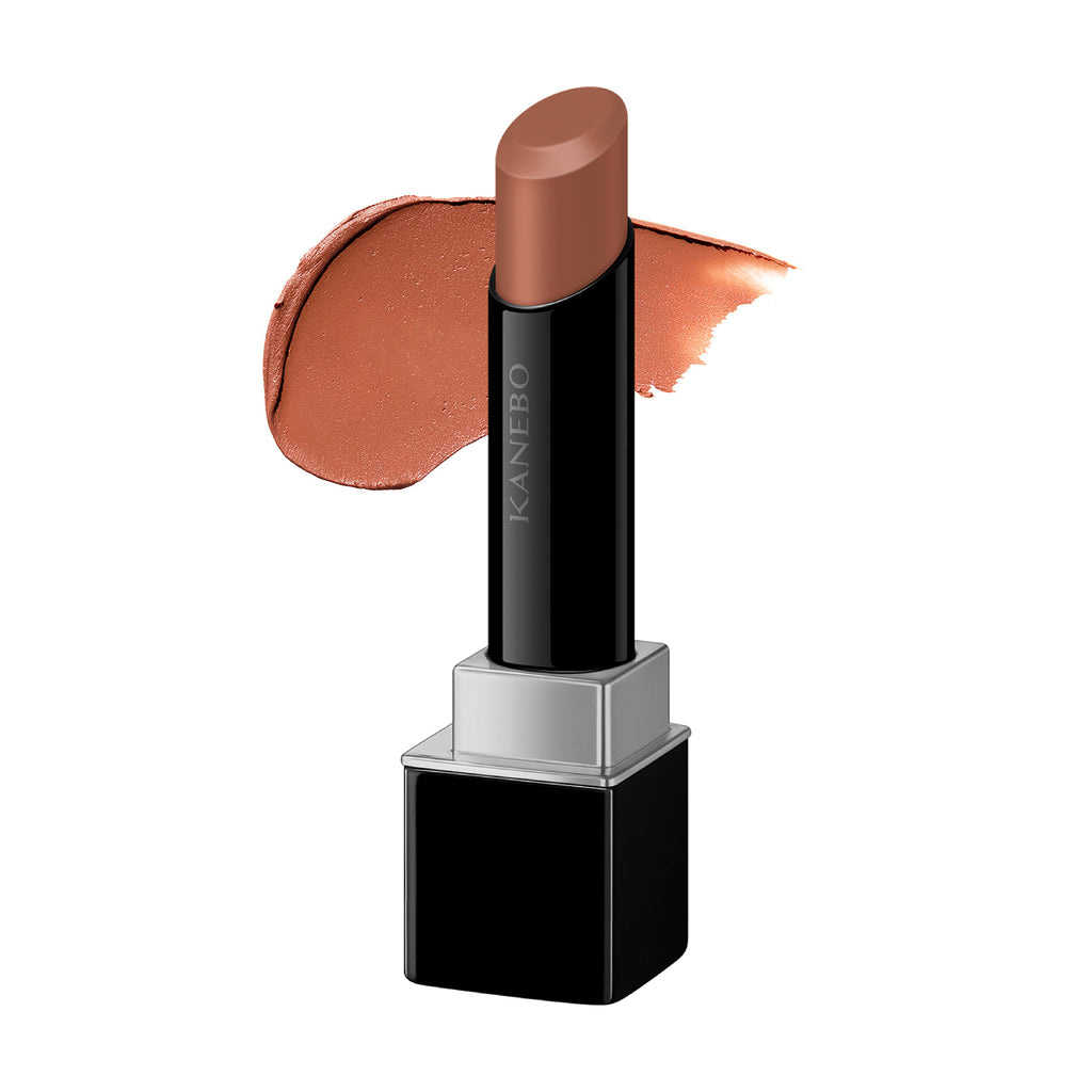 Kanebo Rouge Star Breath lipstick in a warm caramel shade with a smooth texture, shown with a coordinating swatch. Great for a natural, earthy look.