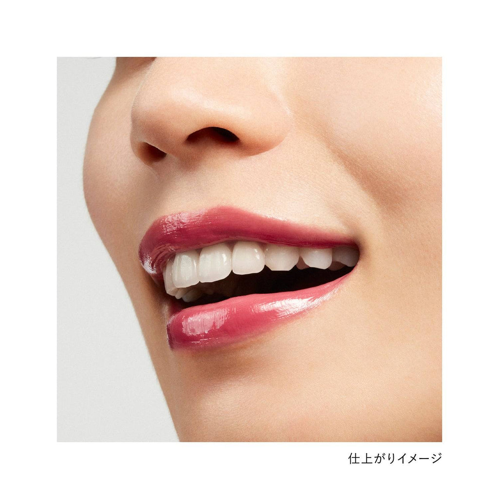Lips wearing Kanebo Rouge Star Vibrant lipstick in a berry shade, showcasing a glossy and bold finish.
