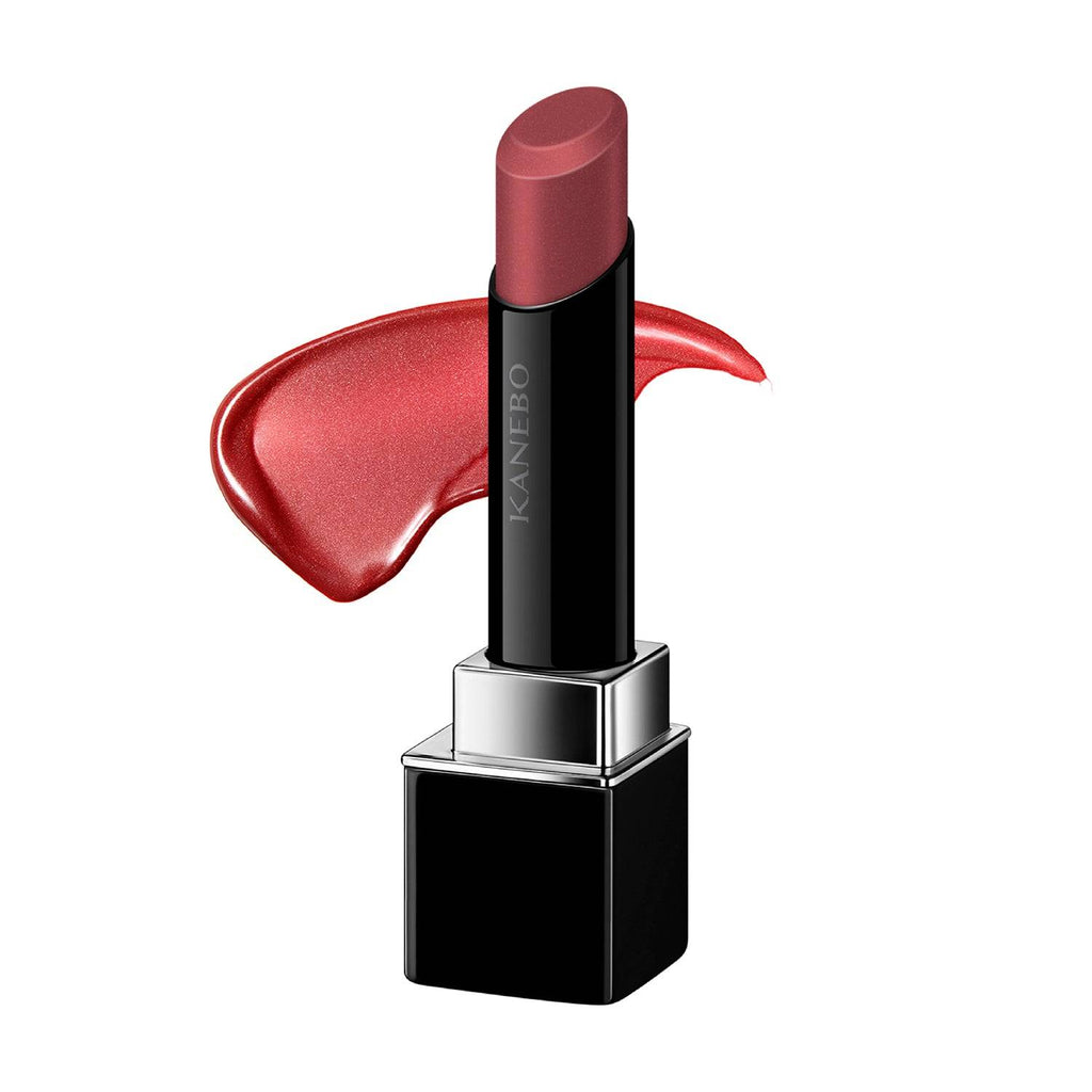 Kanebo Rouge Star Vibrant lipstick in a red shade with a creamy texture and glossy finish, paired with a color swatch.