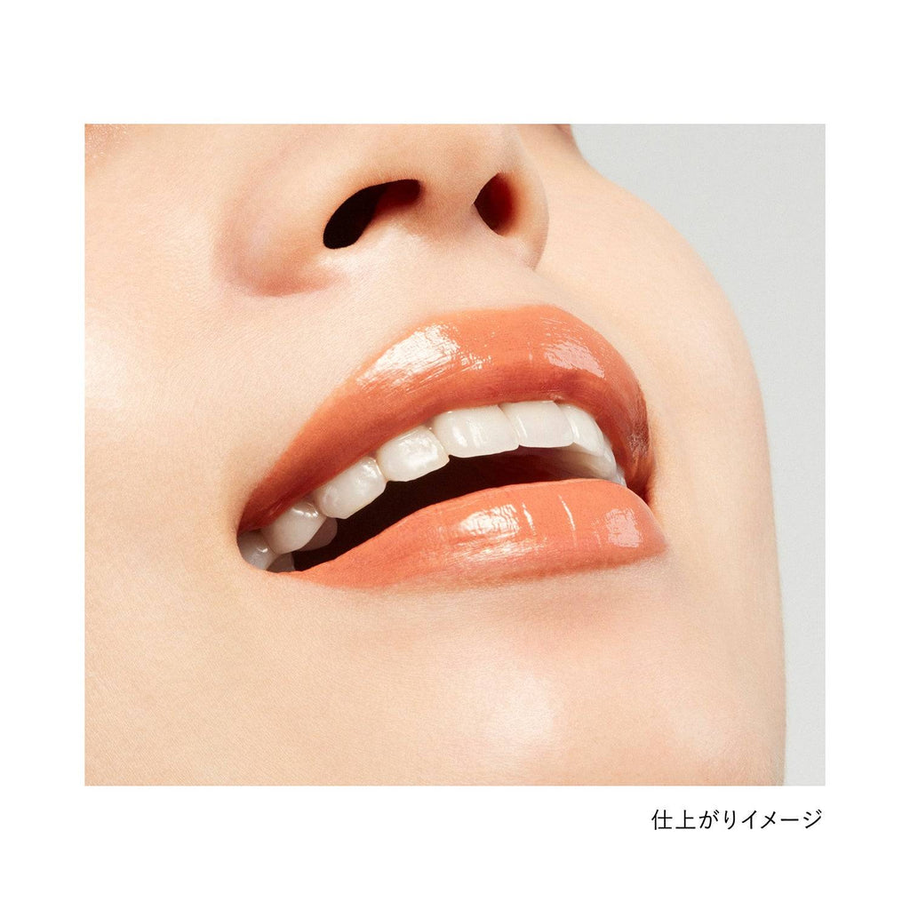 Lips wearing Kanebo Rouge Star Vibrant lipstick in a caramel shade, showcasing a glossy and natural finish.