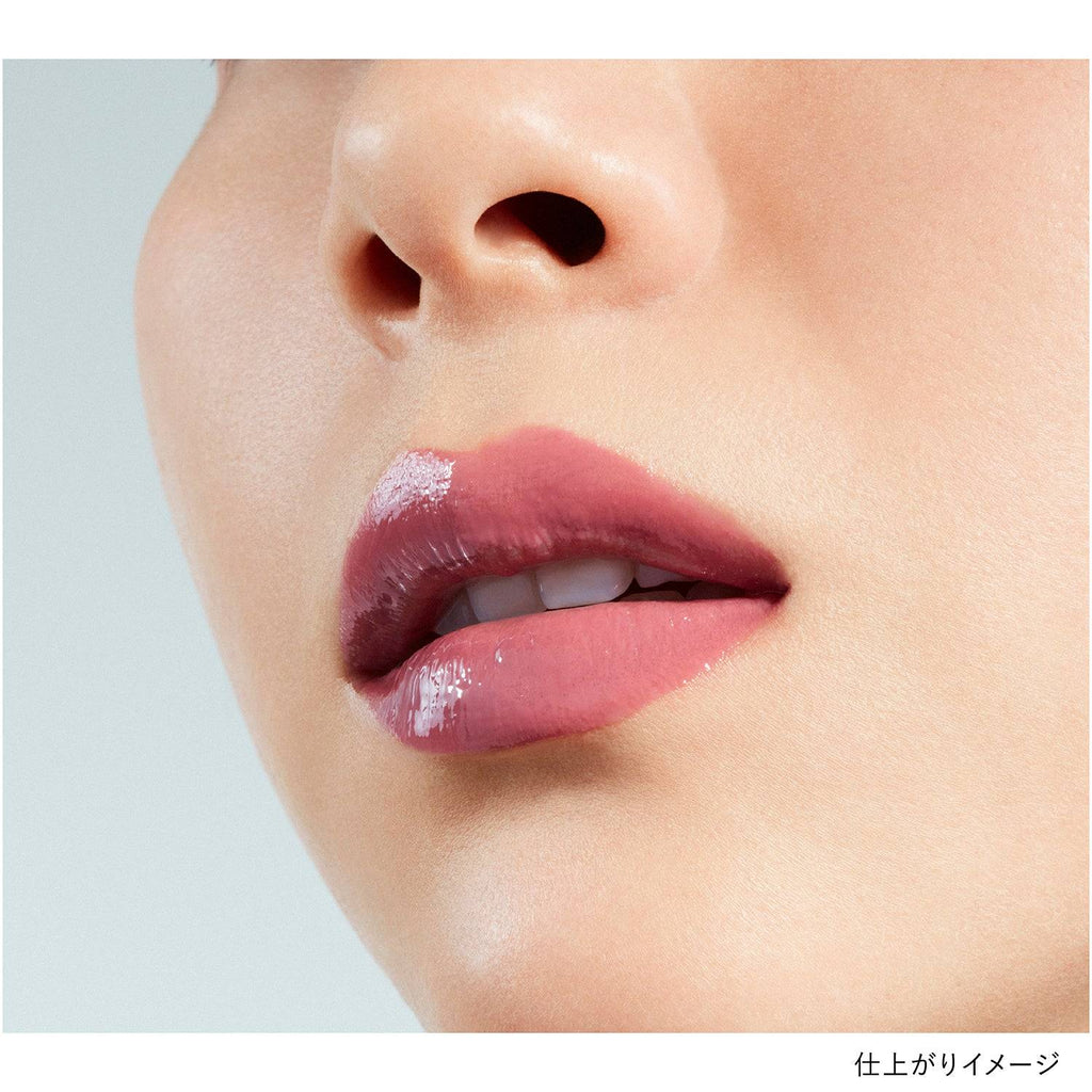 Lips wearing Kanebo Rouge Star Vibrant lipstick in a mauve shade, showcasing a glossy and natural finish.