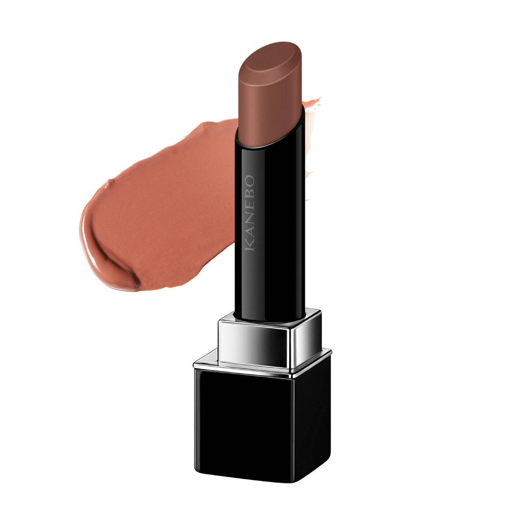 Kanebo Rouge Star Vibrant lipstick in a deep brown shade with a creamy texture and glossy finish, displayed with a color swatch.