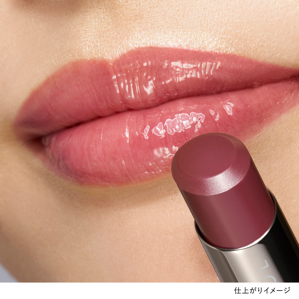 Close-up of lips wearing Lunasol Bare Color Balm in shade 05 Ruffler Rose, showcasing a glossy rose tint.