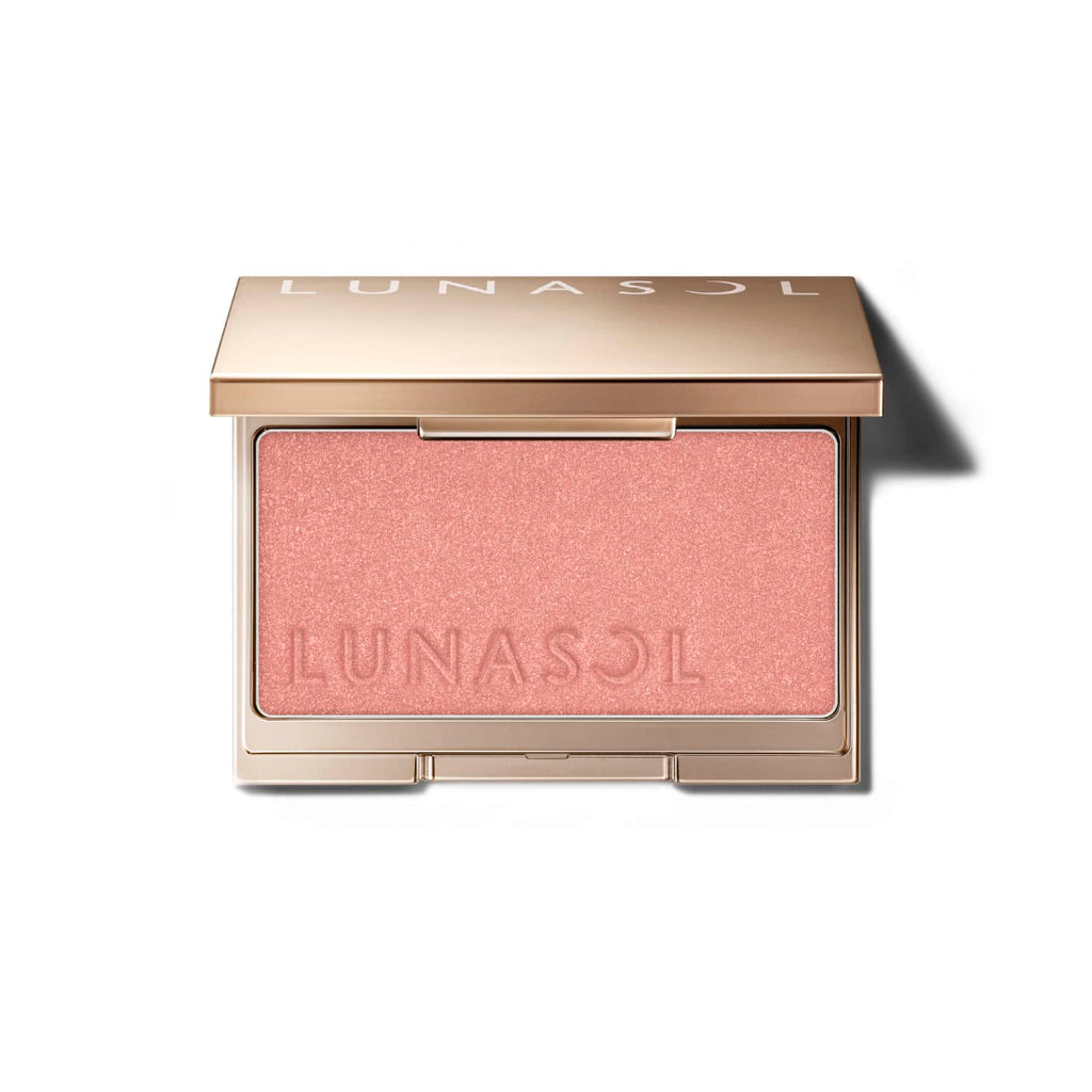 Lunasol Coloring Sheer Cheeks (Glow) in a golden compact with embossed logo, featuring a soft pink shade for a radiant finish.