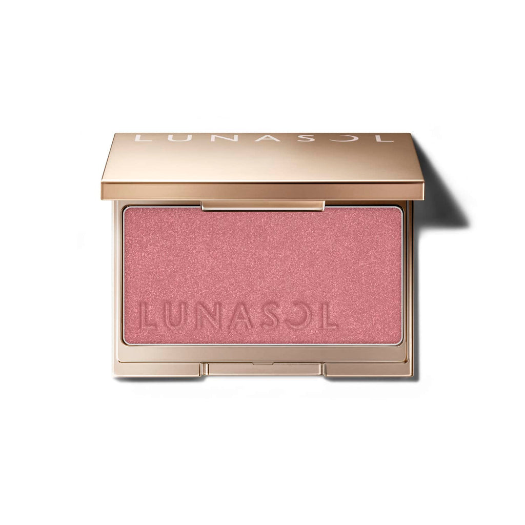 Lunasol Coloring Sheer Cheeks (Glow) in a golden compact with embossed logo, featuring a rosy pink shade for a radiant finish.