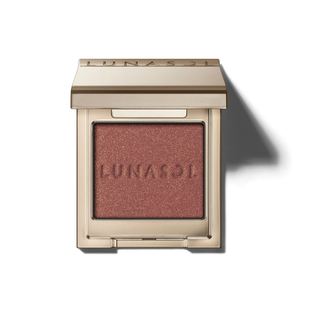 Lunasol Mono Eye Coloration eye shadow in a rich red-brown shimmer, encased in a luxurious gold compact for bold eye makeup.