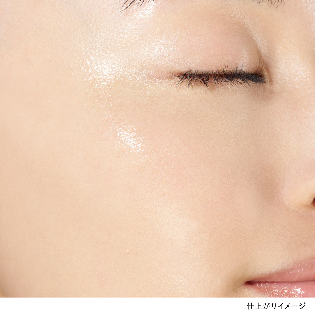 Close-up of skin with Lunasol Radiant Stick N applied, highlighting a dewy, radiant glow on the cheekbone.