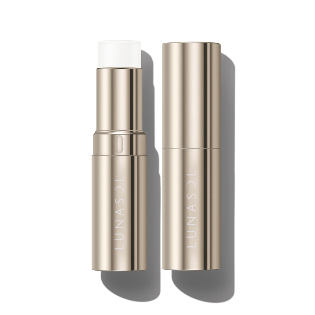 Lunasol Radiant Stick N highlighter in a sleek gold tube, showcasing a creamy white shade for a luminous finish.