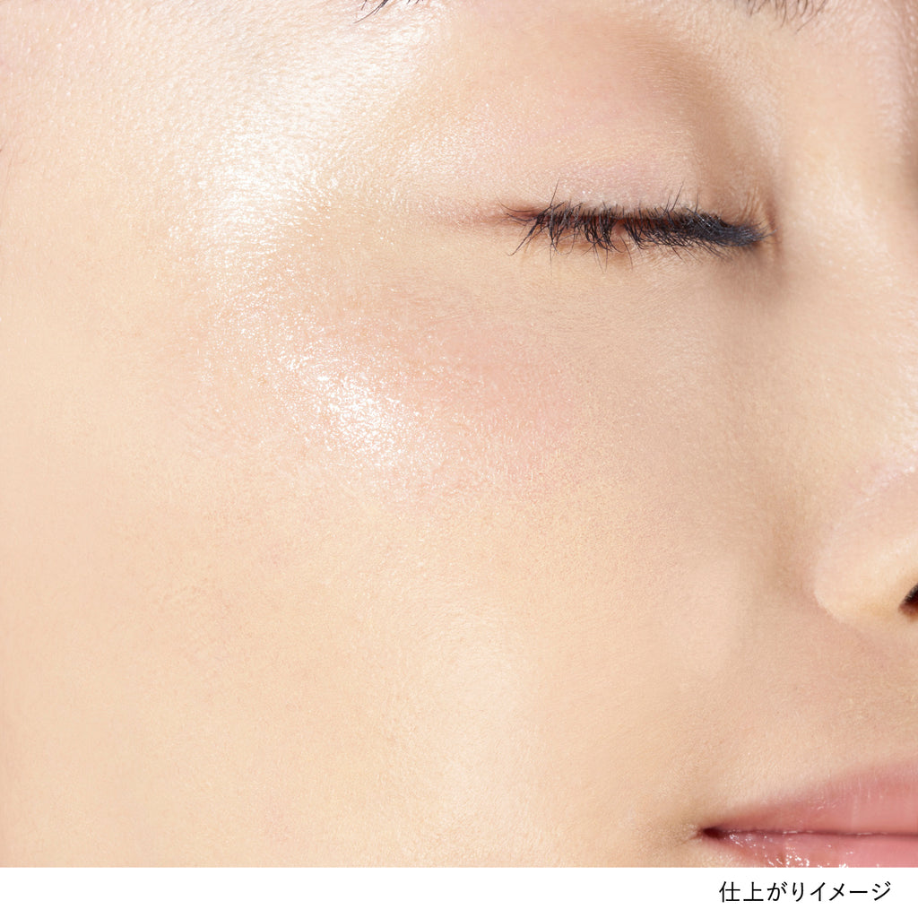 Close-up of skin with Lunasol Radiant Stick N in pink applied, revealing a natural, glowing finish on the cheekbone.