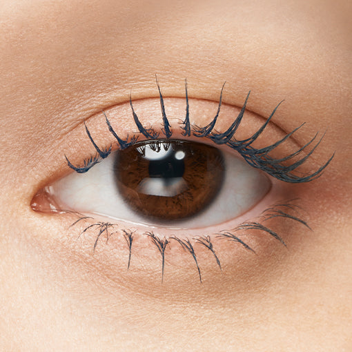 Majolica Majorca Lash Expander mascara tube with brush showcasing lengthened and voluminous lashes for enhanced beauty