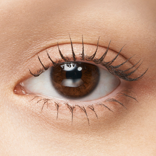 Majolica Majorca Lash Expander mascara tube with brush showcasing lengthened and voluminous lashes for enhanced beauty