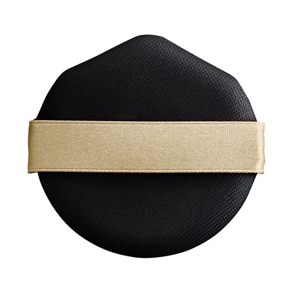 Maquillage cushion foundation puff in black with a gold strap. Designed for smooth and even application of the cushion foundation for a flawless finish.