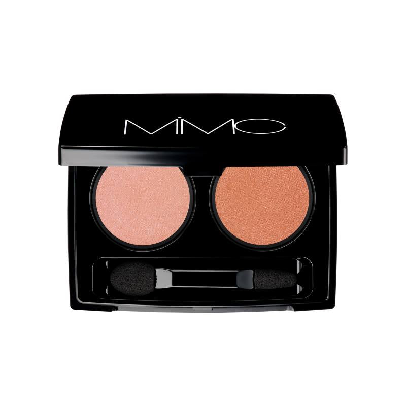 Mimc Bio Moisture Shadow in coral and peach shades, housed in a black compact. Ideal for a soft, radiant eye look.