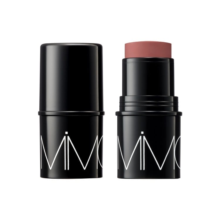 Mimc Mineral Stick Cheek in deep coral shade, a multifunctional waterproof balm for face makeup in a sleek black tube.