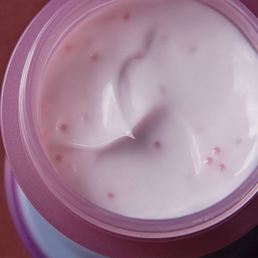 Open jar of Pola From Lost to Beauty Hand Confiture 50g, revealing its creamy, bead-infused lavender formula for hand care.