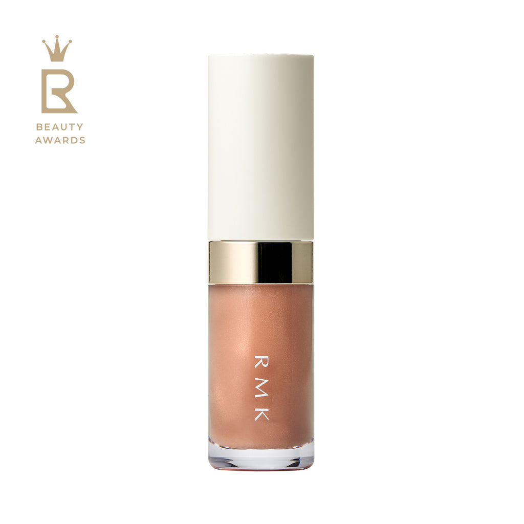 RMK Lip Luminizer 3.6g in caramel amber shade 03, featuring a white and gold cap and a clear tube revealing the nude beige gloss.