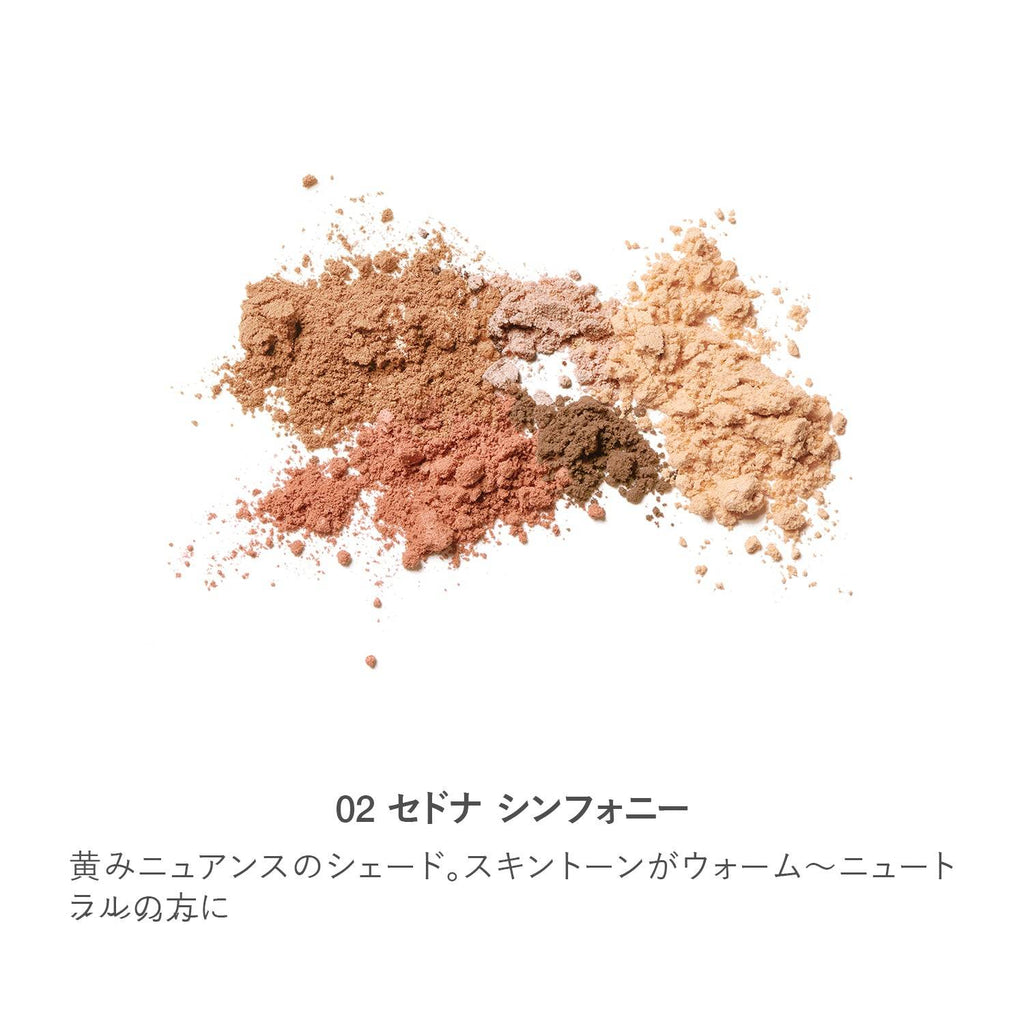 Crushed powder swatches of RMK Shade & Glow Palette in shade 02 Sedona Symphony, featuring warm-neutral tones for a sun-kissed finish.