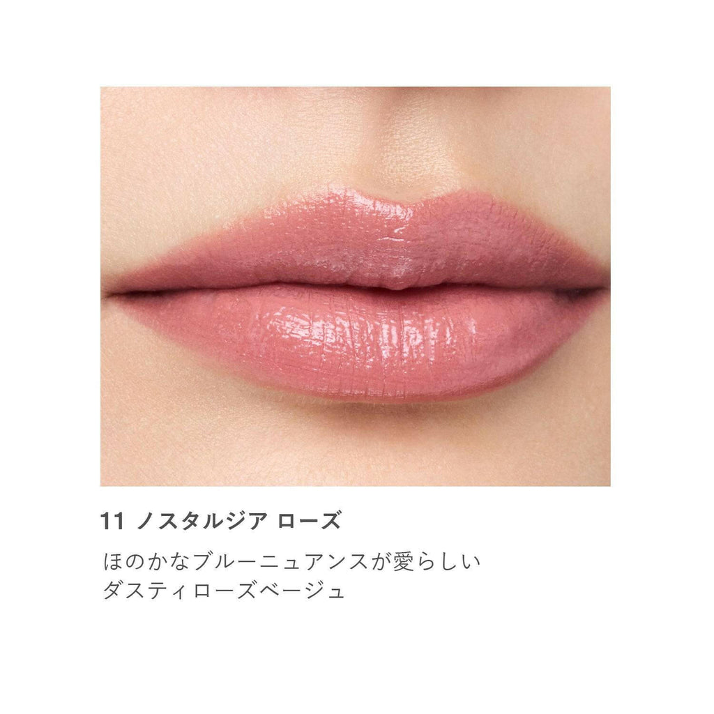 Close-up of lips wearing RMK Liquid Lip Color in shade 11 Nostalgia Rose, a dusty rose beige with a soft, natural finish.