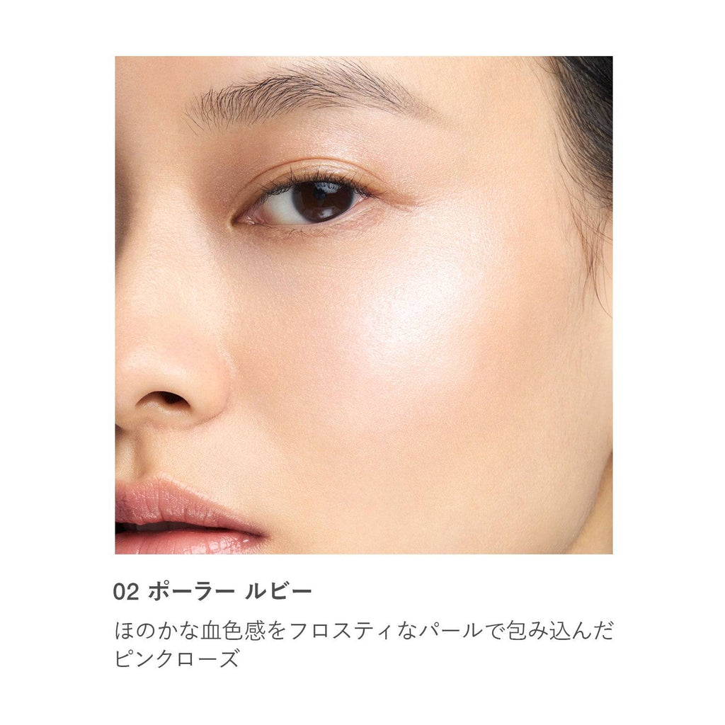 Close-up of RMK Radiant Color Stick 6.4g in shade 02 Polar Ruby applied on skin, highlighting a soft pink glow.