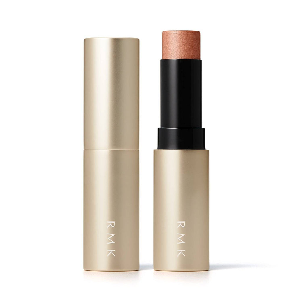 RMK Radiant Color Stick 6.4g in shade 06 Ice Spice with gold casing, featuring a peachy bronze tone for a healthy glow.