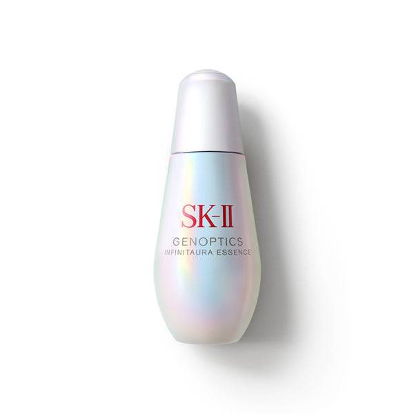 SK-II Genoptics Infiniteaura Essence skincare serum with Pitera™ in a luminous bottle. Designed to improve skin radiance, smoothness, and hydration.