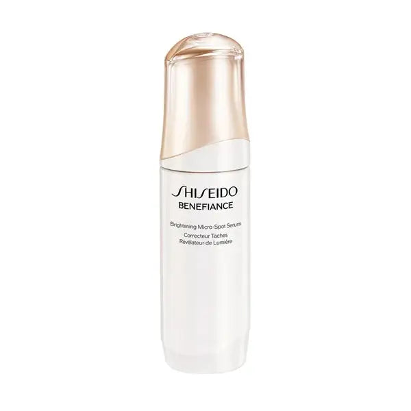 Shiseido Brightening Micro-Spot Serum in an elegant white bottle with gold accents. A powerful anti-aging formula for smooth, radiant skin.