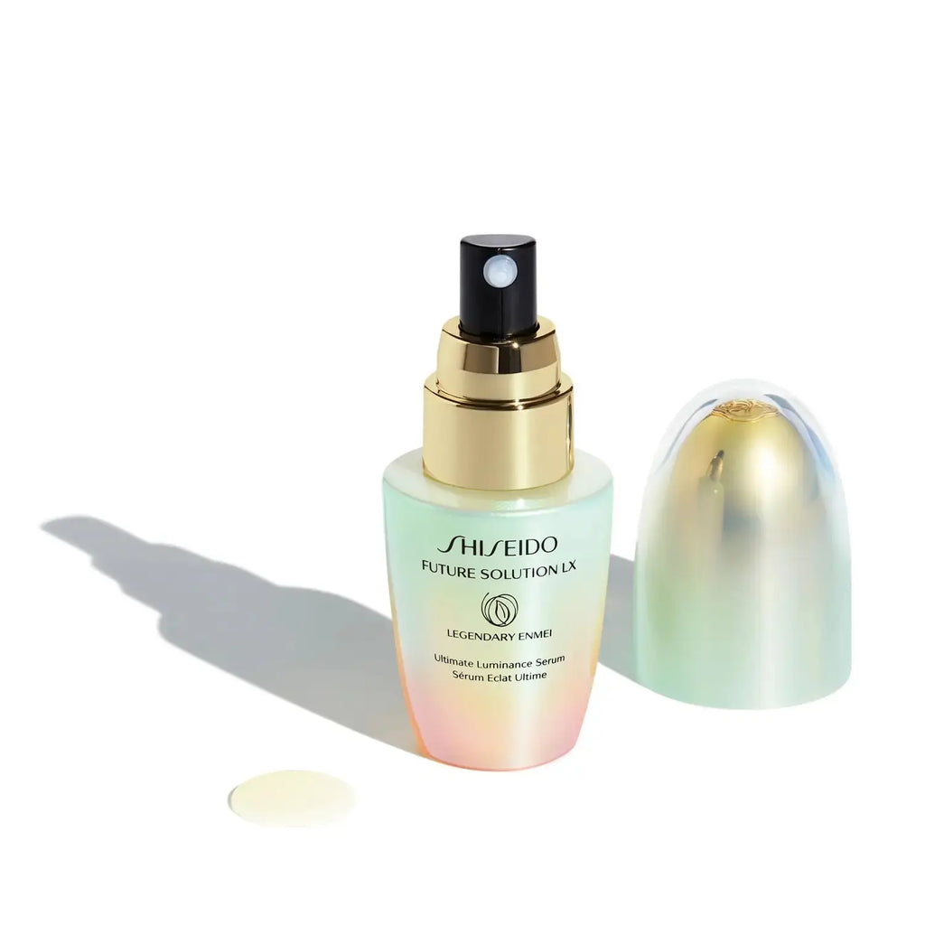 Shiseido Future Solution LX Legendary EN Luminance Serum 30ml with the cap removed, showing the pump dispenser and creamy serum texture.