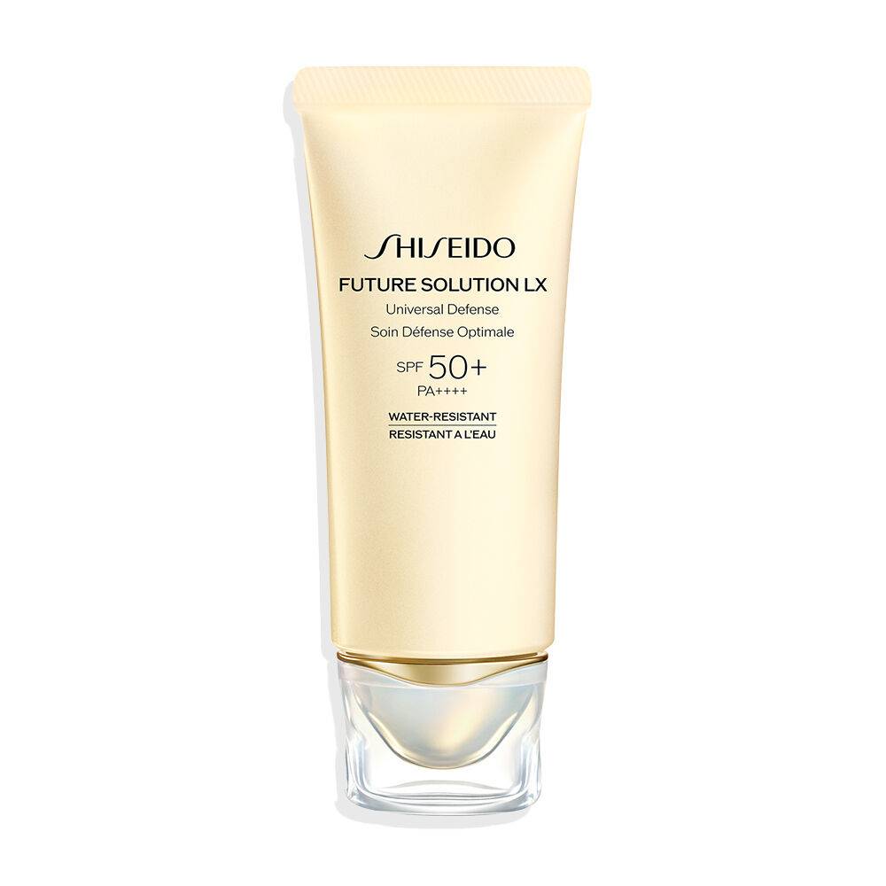 Shiseido Future Solution LX Universal Defense Cream with SPF50+ in an elegant gold tube. Offers anti-pollution protection and enhances skin radiance.