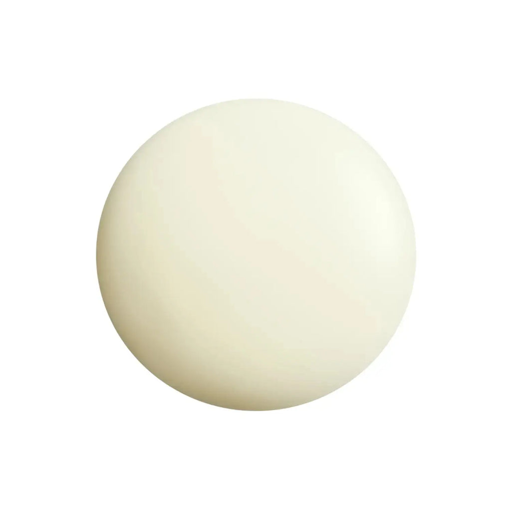 Close-up of the Shiseido Urban Triple Beauty Suncare Emulsion texture, highlighting its smooth, lightweight formula for effective sun protection.