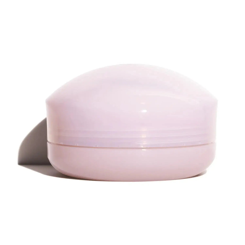 Shiseido White Lucent Brightening Skin Care Powder N in a closed compact with a sleek, pastel pink design for portable skincare.