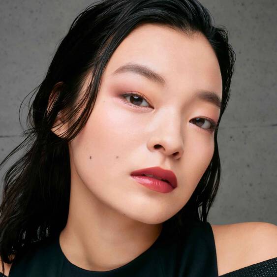 Model wearing Shu Uemura Eye Sculpt eye shadow, showcasing a soft and elegant eye makeup look with pink-toned shades.