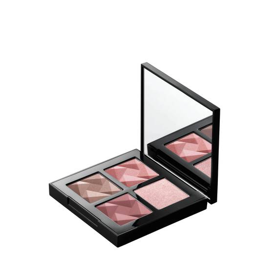 Open Shu Uemura Eye Sculpt palette showcasing four pink-toned eye shadow shades with a built-in mirror and geometric textures.