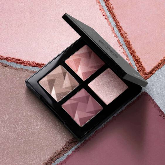 Shu Uemura Eye Sculpt palette displayed with its four pink-toned shades surrounded by matching powder textures.