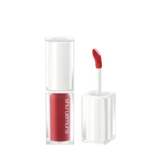 Shu Uemura Kinu Care Glow Up 5.5ml lip gloss in KG OR 599 Candy Ginger shade with a precise applicator and vibrant orange hue.