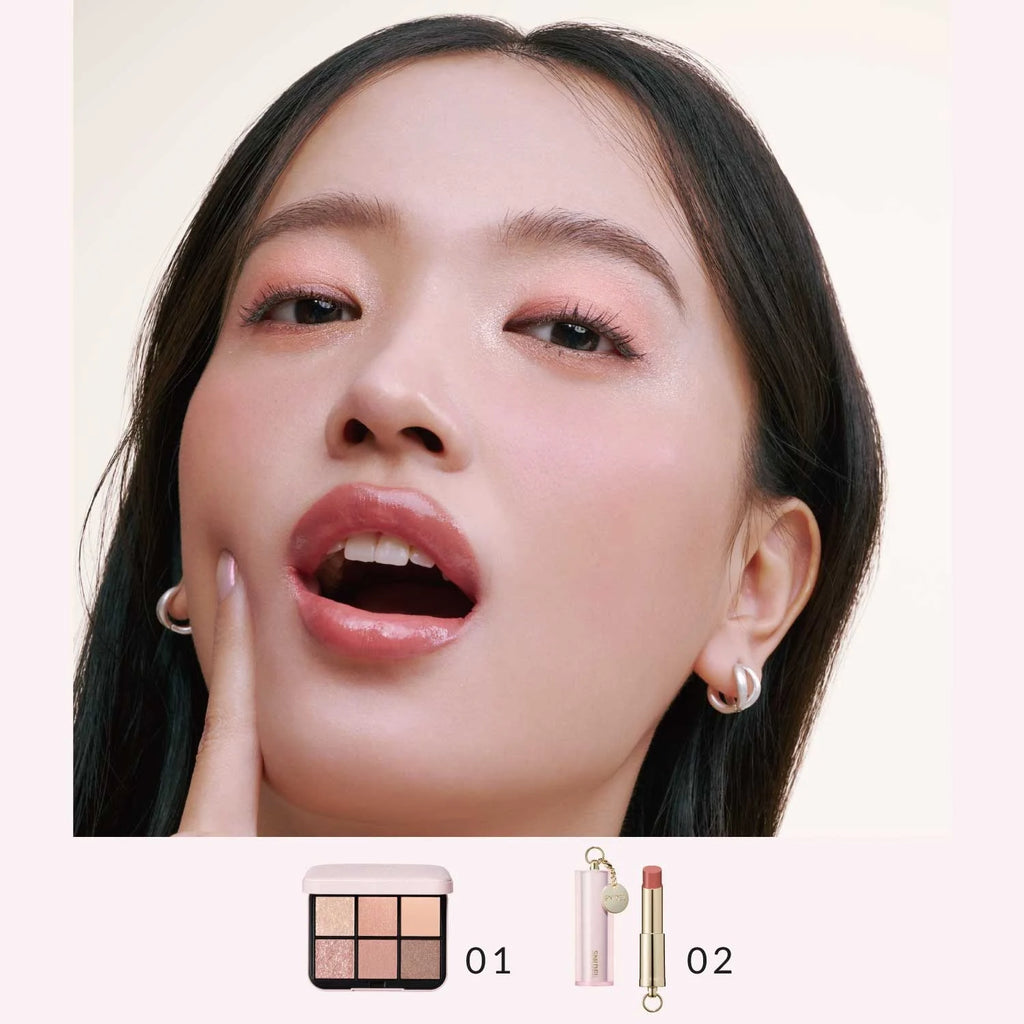 Model showcasing Snidel Beauty 01 Coral Charm eye shadow palette with soft coral makeup look, paired with matching lipstick.