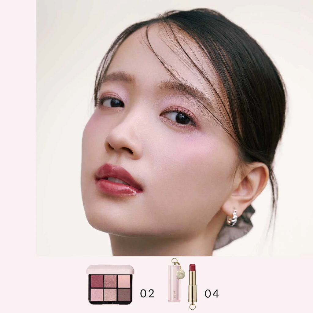 Model wearing Snidel Beauty 02 Dress up Pink eye shadow palette with a romantic pink makeup look, complemented by matching lipstick.