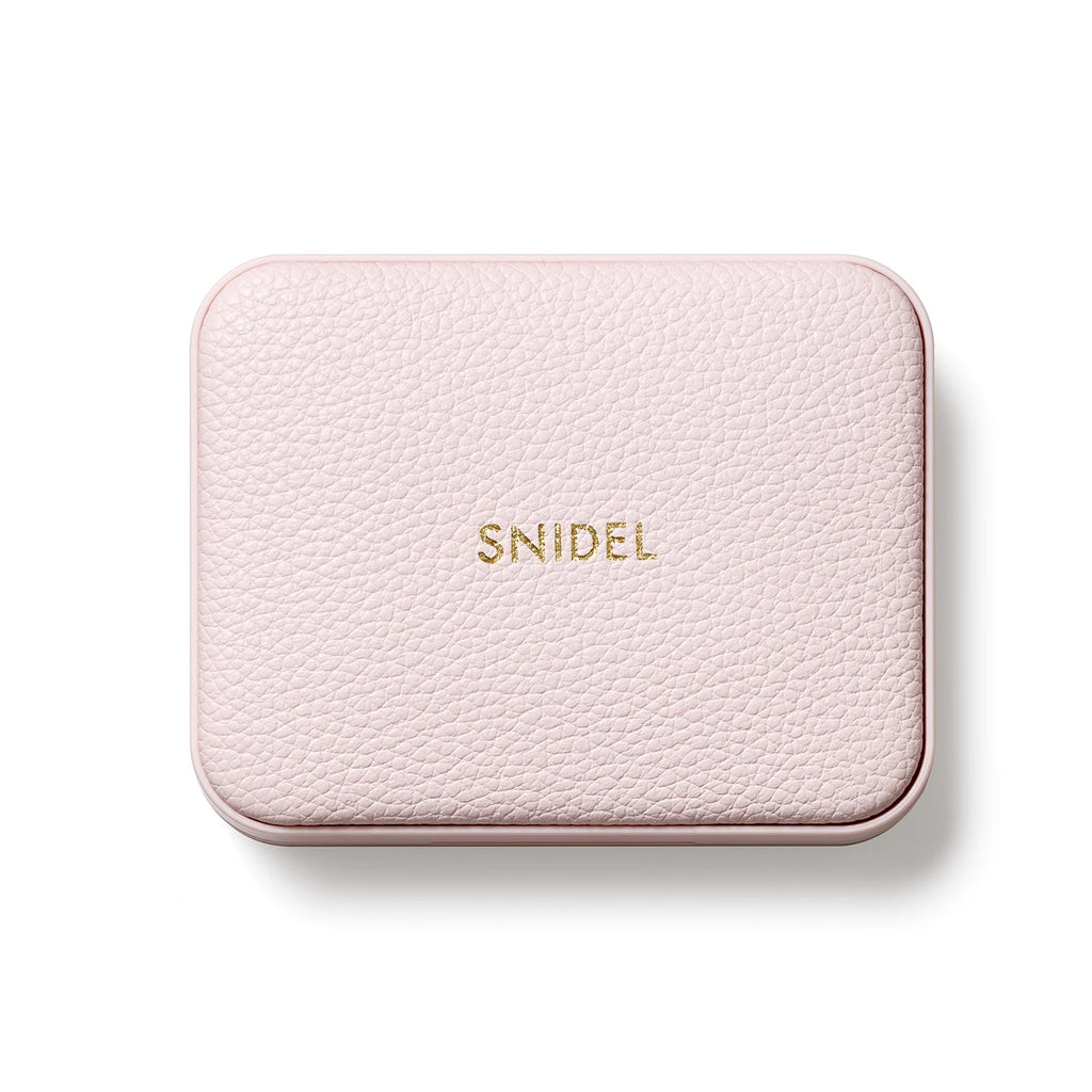 Snidel Beauty Tokyo Beauty Box with a pink textured case and gold embossed logo, part of the 2025 SS Collection.