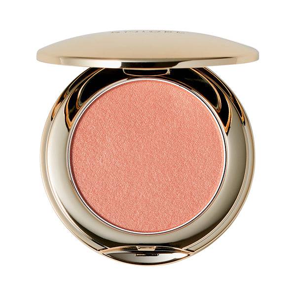 Snidel Beauty Skin Glow Blush in a vibrant coral shade, designed for a bold and radiant look. Comes in a gold compact.