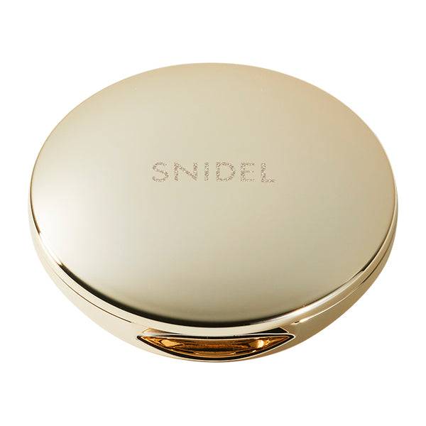 Snidel Beauty Skin Glow Blush compact in a sleek gold design with the Snidel logo engraved, offering a luxurious aesthetic.