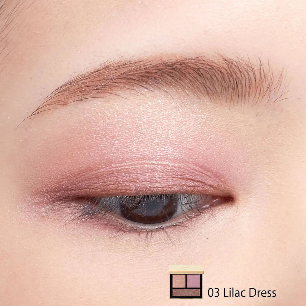 Close-up of an eye wearing Snidel Beauty Tailored Color Eyes 03 Lilac Dress, showcasing a delicate lilac and mauve eye makeup look with a subtle shimmer.