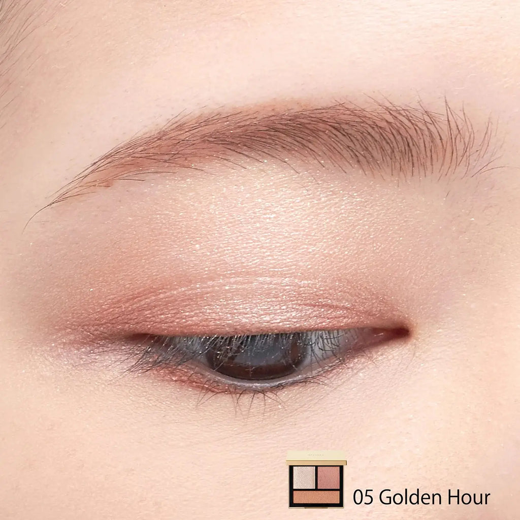 Close-up of an eye wearing Snidel Beauty Tailored Color Eyes 05 Golden Hour, featuring a radiant gold and peach eye makeup look with a soft shimmer.