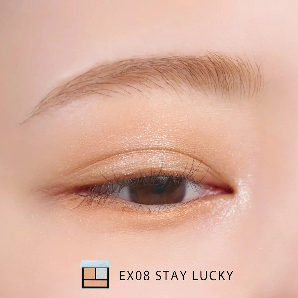 Close-up of an eye with a soft, natural look using Snidel Beauty EX08 Stay Lucky palette in gold and silver tones.