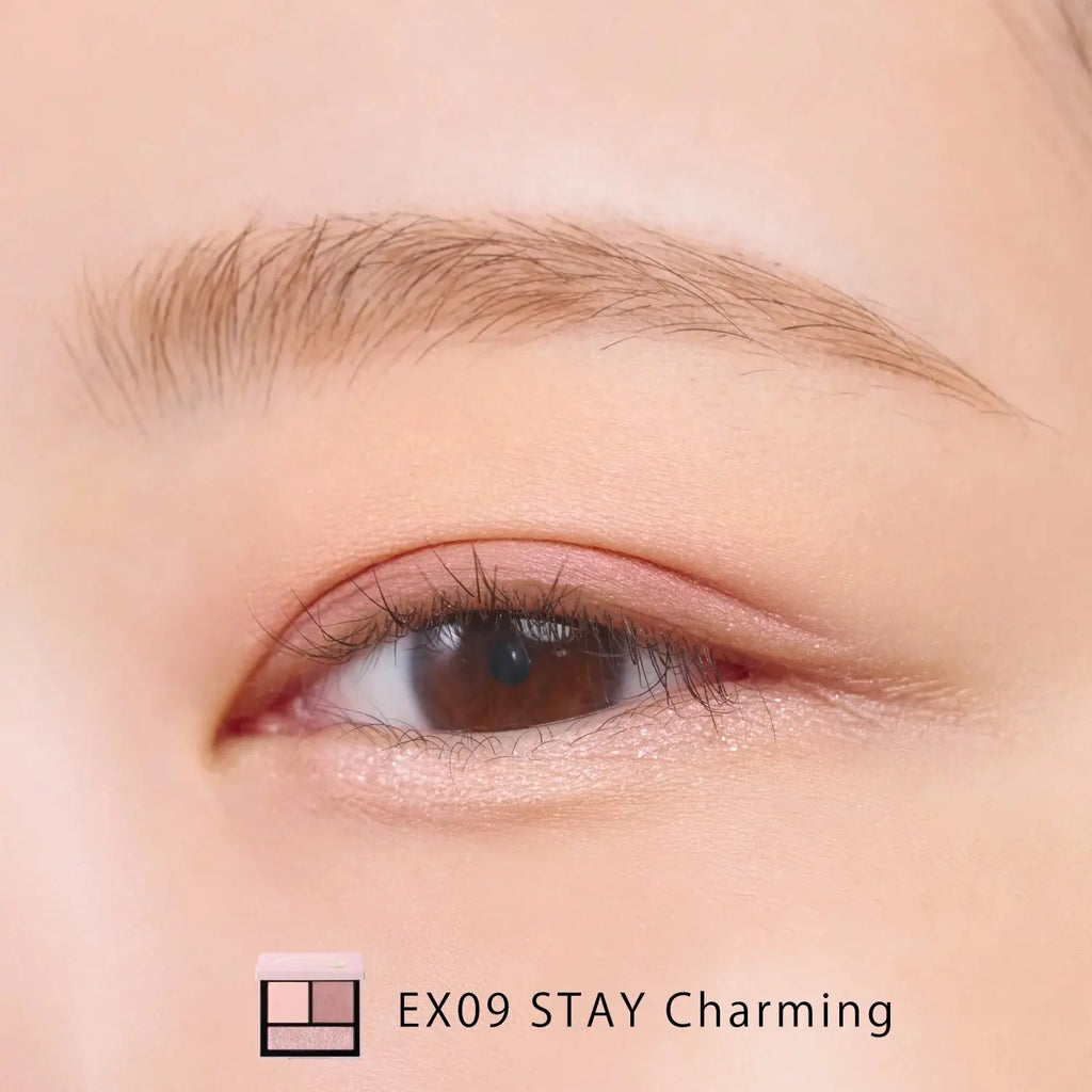 Close-up of an eye wearing Snidel Beauty EX09 Stay Charming palette with soft pink and mauve tones for a romantic look.