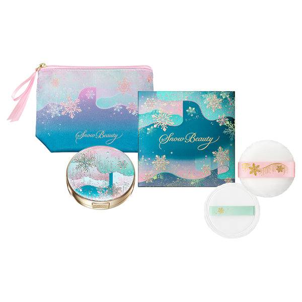Complete Snow Beauty Brightening Skin Care Powder A set including compact, puff, pouch, and decorative box with snowflake motifs.