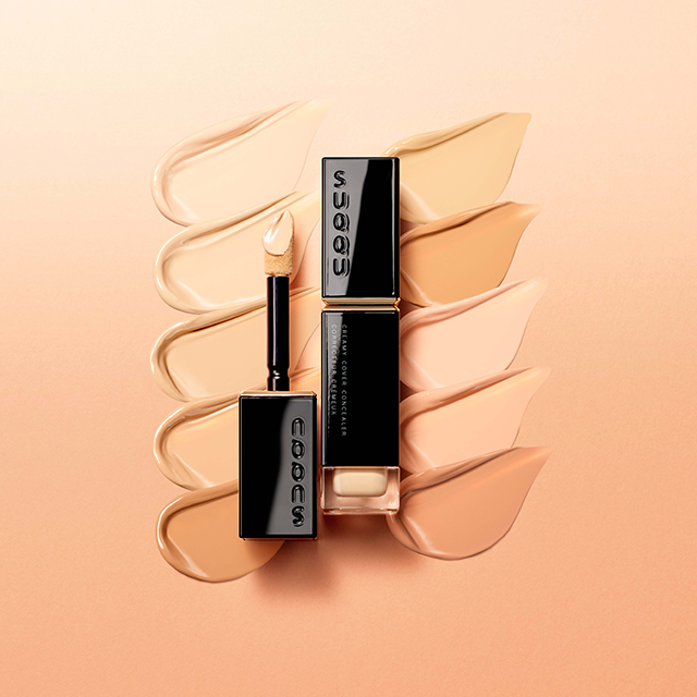 Suqqu concealer providing seamless coverage for a flawless complexion, enhancing natural beauty with premium quality makeup