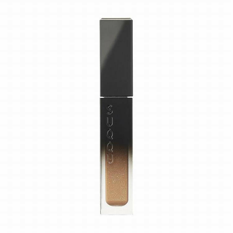Suqqu Liquid Luster Eyes 7.3g in a sleek black and silver tube, featuring a golden shimmer liquid eyeshadow for easy blending.