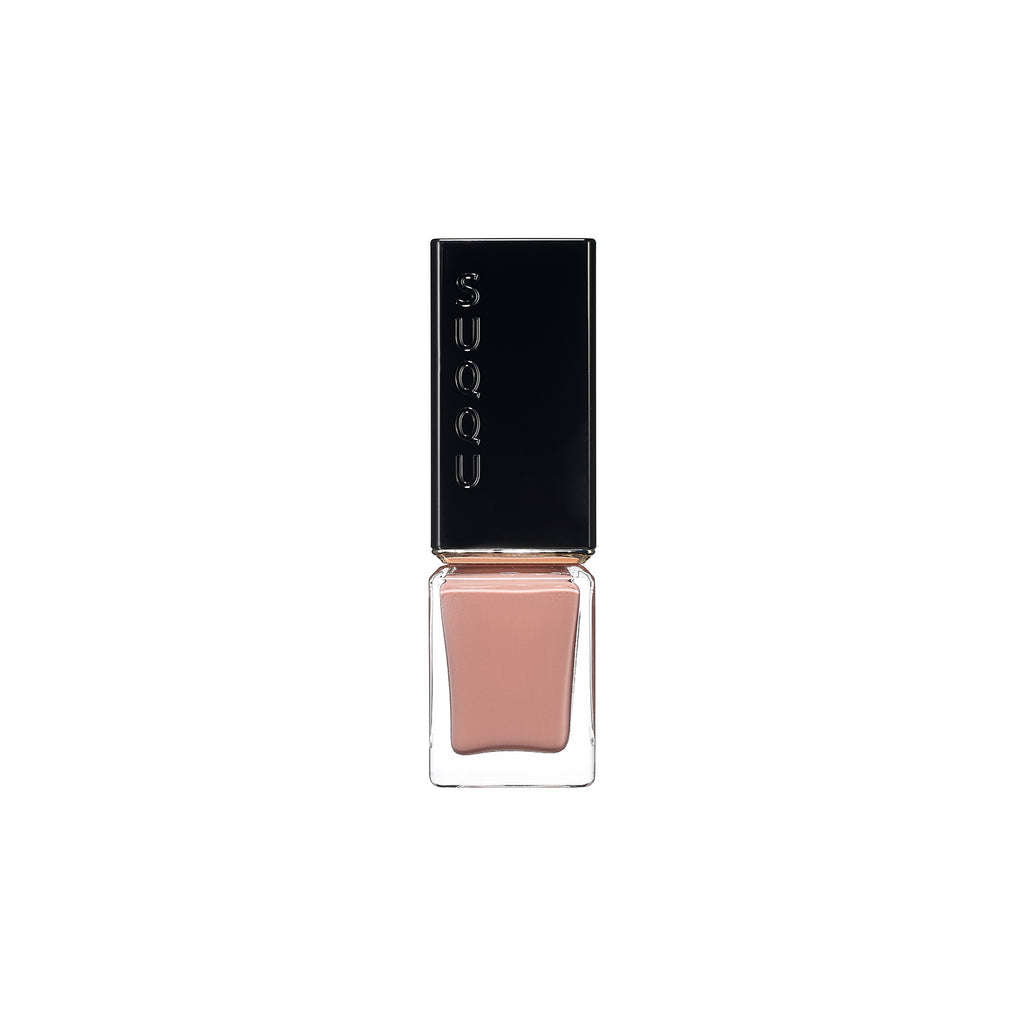 Suqqu Nail Color Polish in a warm peachy nude shade, perfect for a natural manicure look.